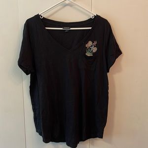 Torrid black short sleeve tee with surprise skull in pocket